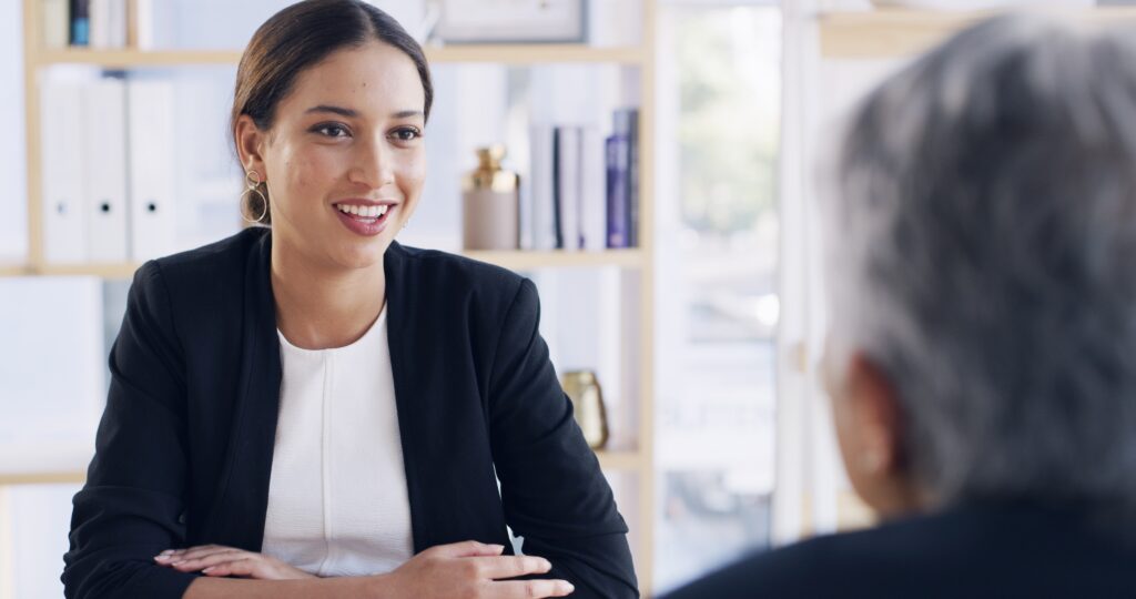 A sales rep meeting with a long-term client in January